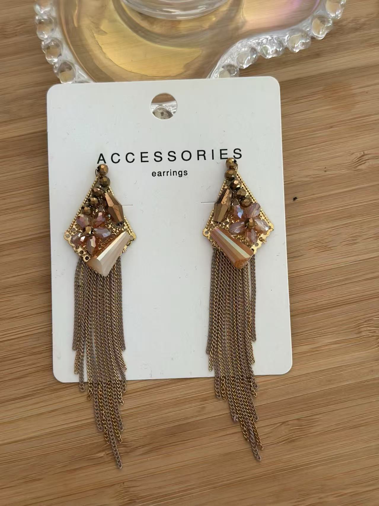 Golden Glam Triangle Earring with Crystal Floral Detail and Chain Fringe
