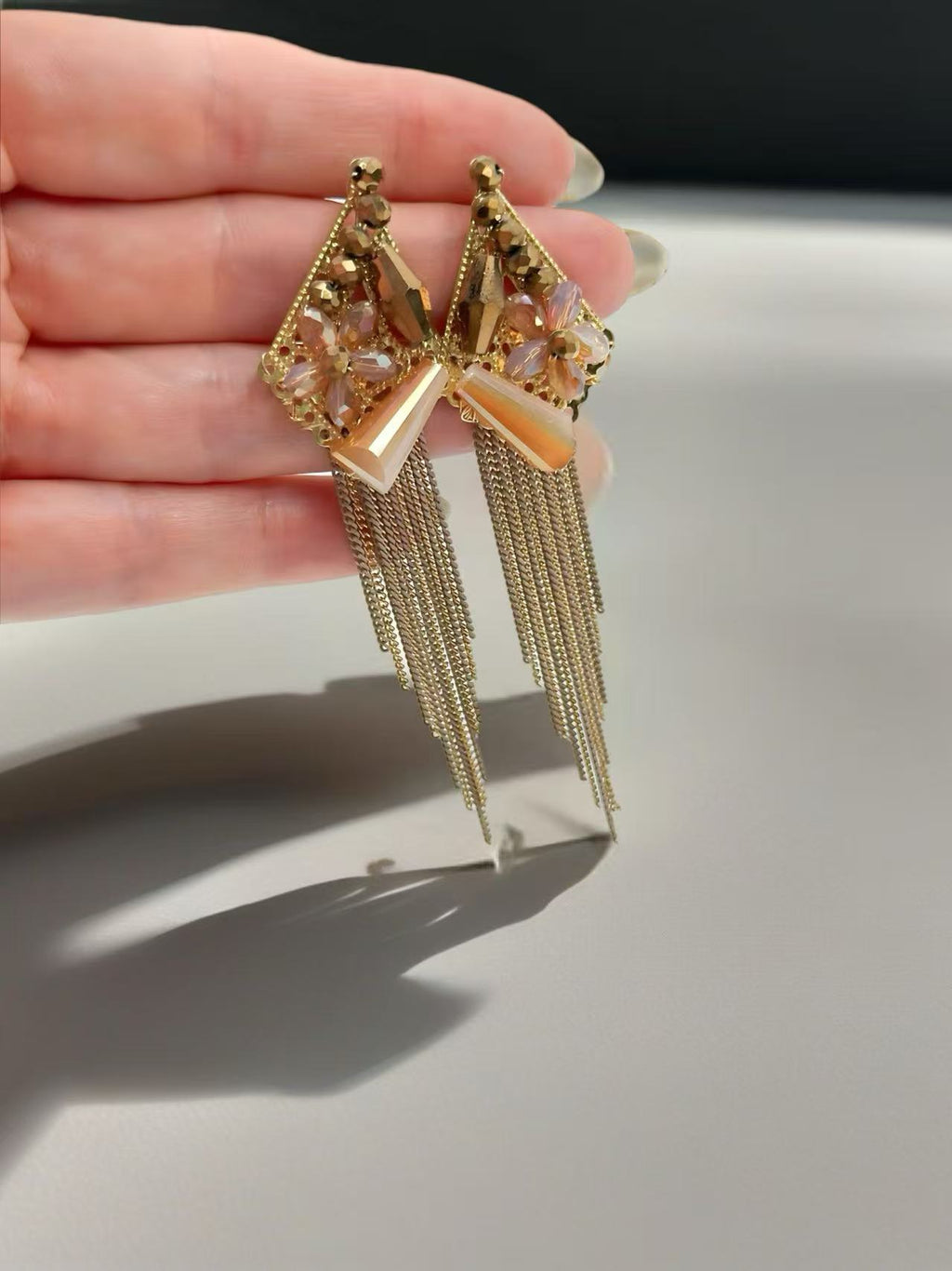 Golden Glam Triangle Earring with Crystal Floral Detail and Chain Fringe