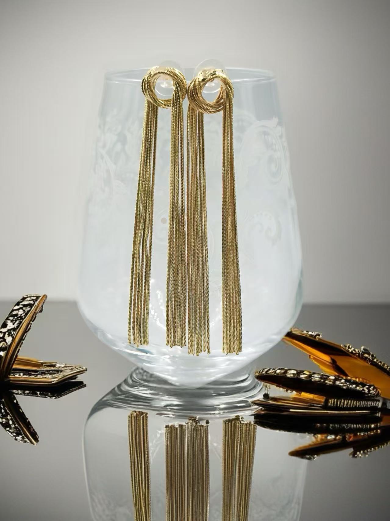 Gold Knot Tassel Statement Earrings