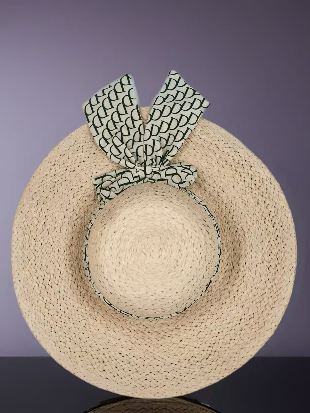 Beige Woven Straw Hat with Patterned Bow