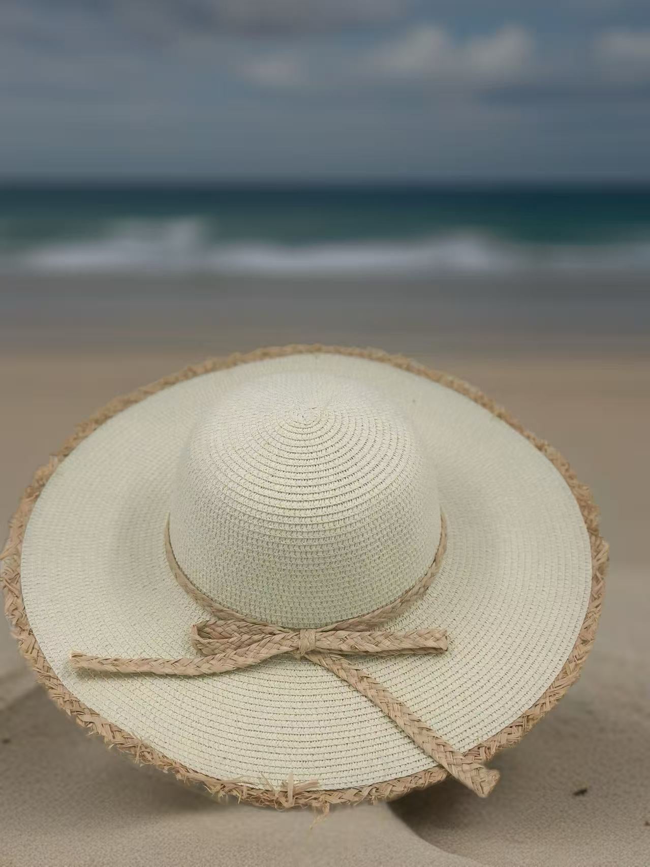 Ivory Wide-Brim Hat with Braided Straw Bow and Fringed Edge