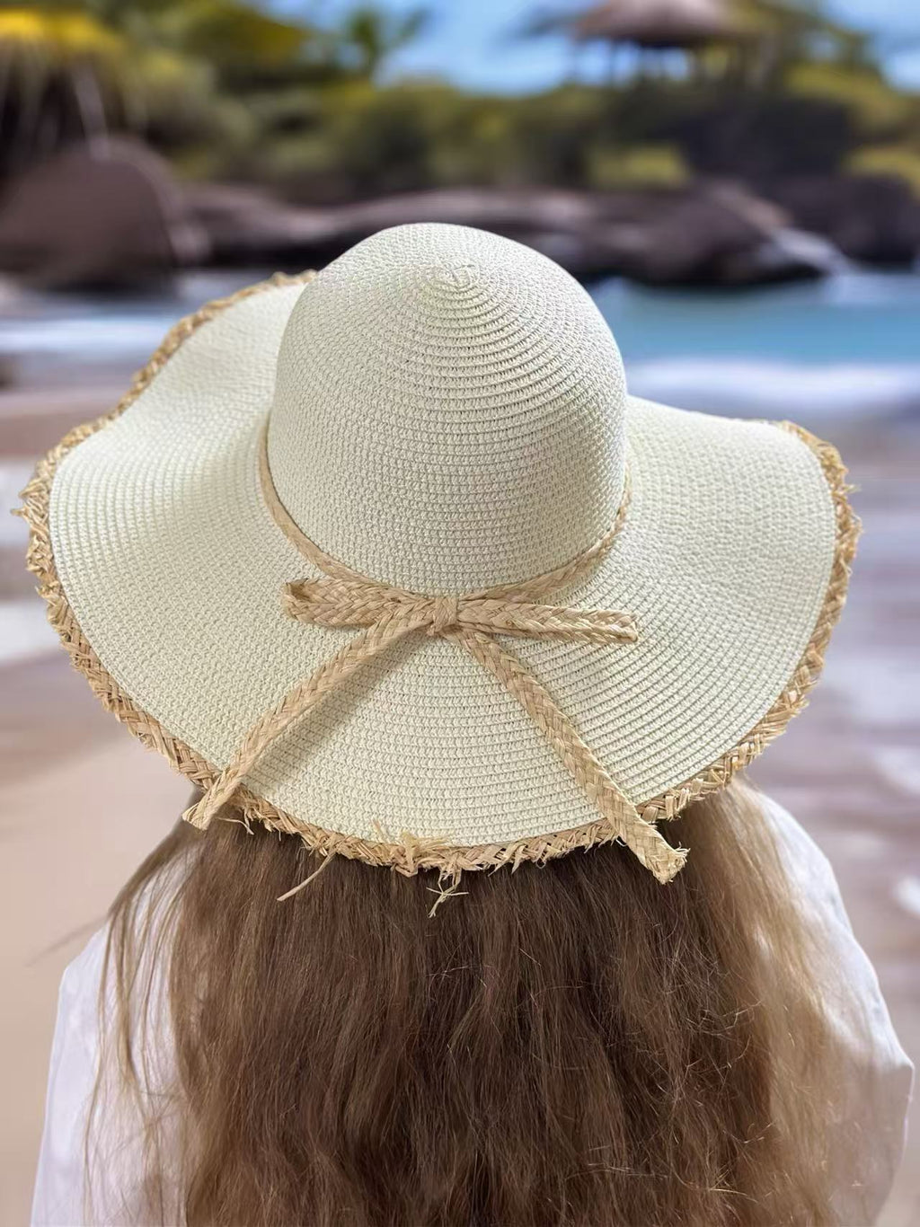 Ivory Wide-Brim Hat with Braided Straw Bow and Fringed Edge
