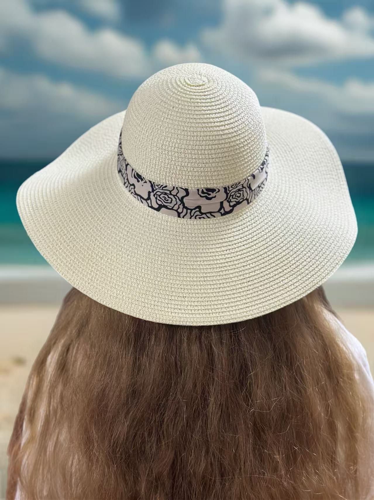 Elegant Wide-Brim Straw Hat with Black Rose Pattern Band