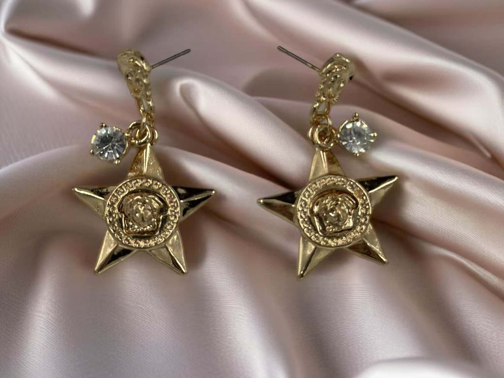 Bold Star Drop Earrings with Crystal and Medusa Motif